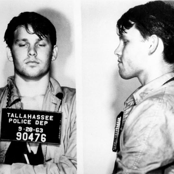 In 1966, Jim Morrison was arrested after kissing a girl they met on a road trip. He later thought he murdered his friend Phil O'Leno, who went missing after their heated argument, but found out Phil had just gone on a walkabout in Arizona.